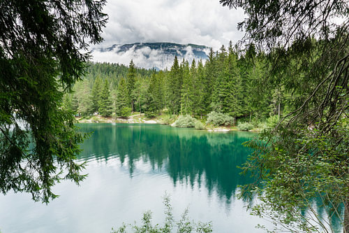 Water, mountains and trees at Caumasee in Switzerland