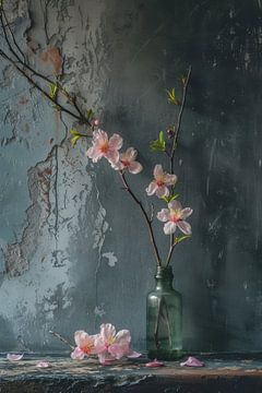 Pink flowers in transparent vase with concrete wall still life