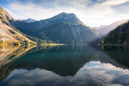 Vilsalpsee Lake in Austria: Clear Reflections and Mountain Views on a Serene Autumn Day