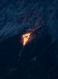Traditional mountain fires over Ehrwald - impressive lines of light on the slopes of the Wetterstein, which bathe the Tyrolean mountains in a magical glow. An extraordinary motif of Alpine culture. by Miriam Schwarzfischer Fotografie