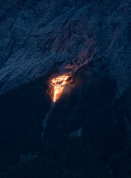 Traditional mountain fires over Ehrwald - impressive lines of light on the slopes of the Wetterstein, which bathe the Tyrolean mountains in a magical glow. An extraordinary motif of Alpine culture.