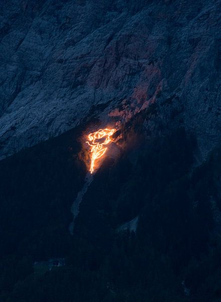Traditional mountain fires over Ehrwald - impressive lines of light on the slopes of the Wetterstein, which bathe the Tyrolean mountains in a magical glow. An extraordinary motif of Alpine culture. by Miriam Schwarzfischer Fotografie