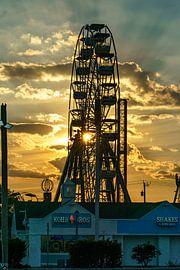 Setting sun in Virginia Beach. by Jaap van den Berg