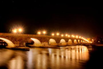 Stone bridge to Regensburg at night by Roith Fotografie