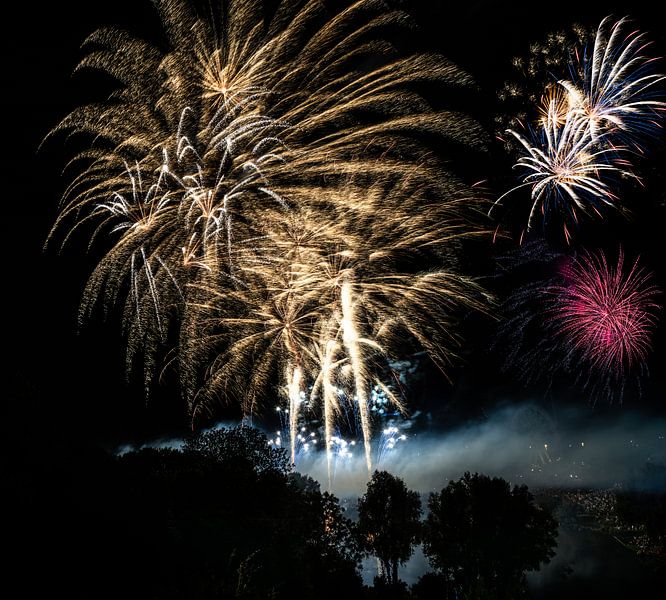 Large fireworks spectacle in a park by ManfredFotos