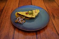 Taco with minced meat-avocado-onion filling arranged on a plate. by Babetts Bildergalerie thumbnail