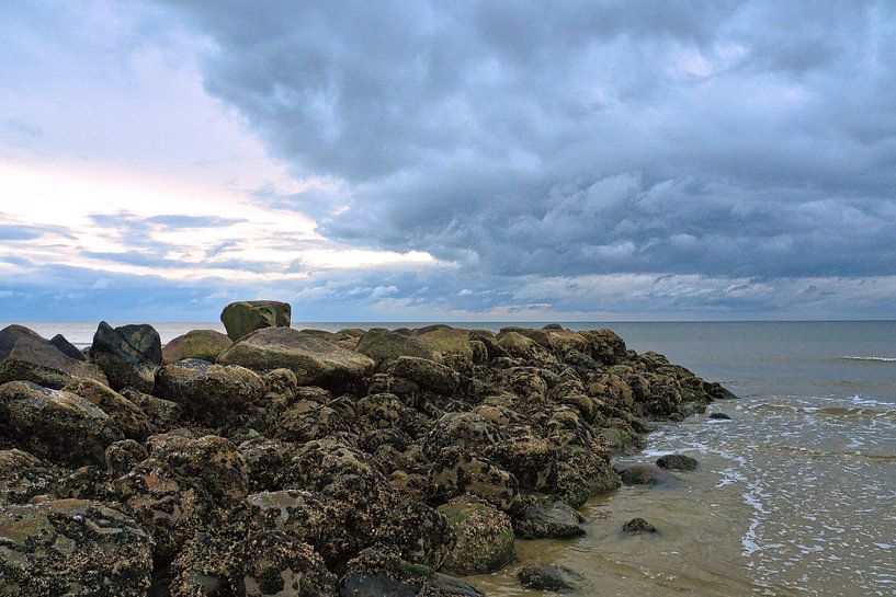 On the beach of Blåvand stone groynes into the sea by Martin Köbsch