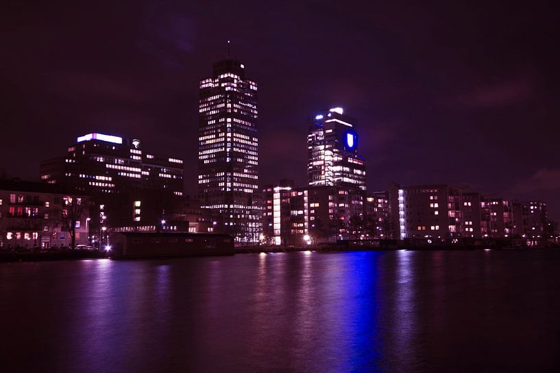 Skyline of Amsterdam on the Amstel at night by Eye on You