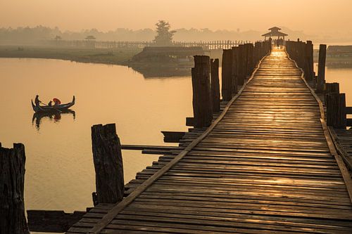Gondola rides at sunrise along the U BAIN Mandelay bridge in Myanmar. The bridge is the longest teak by Wout Kok