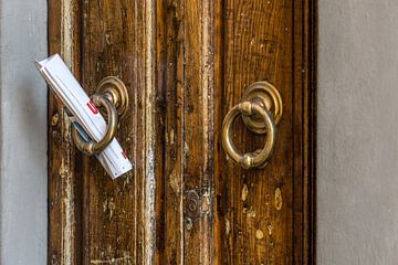 Door with newspaper by FotoSynthese