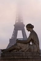 The Eiffel Tower in a misty sunrise