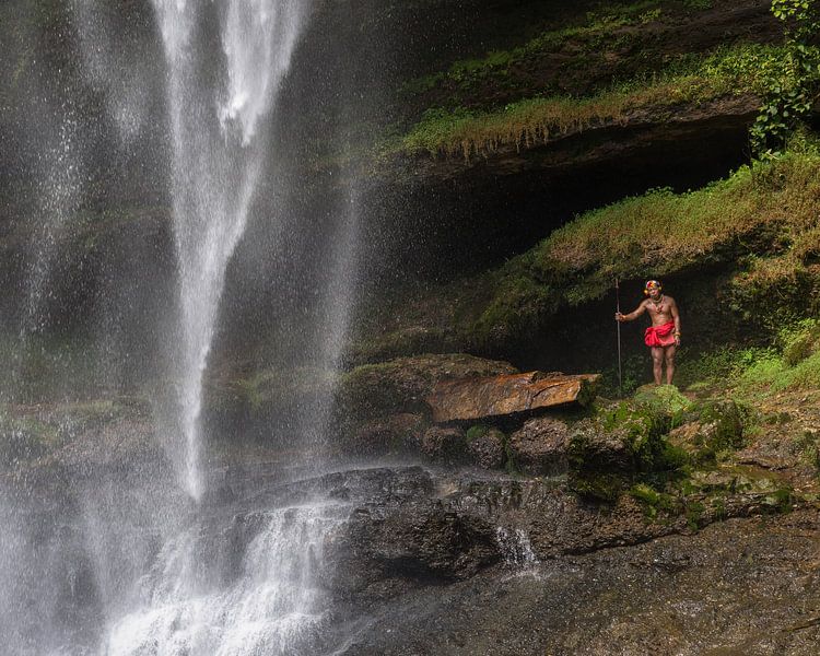 A Sikerei man at the waterfall by Anges van der Logt