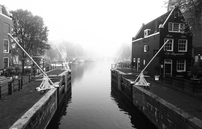 Amsterdam during a foggy morning. by By Karin