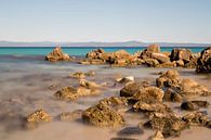 Greek coastline with rocks and sea in the foreground by Miranda van Hulst thumbnail