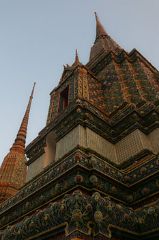 Unique view of a Buddha pagoda against clear sky.