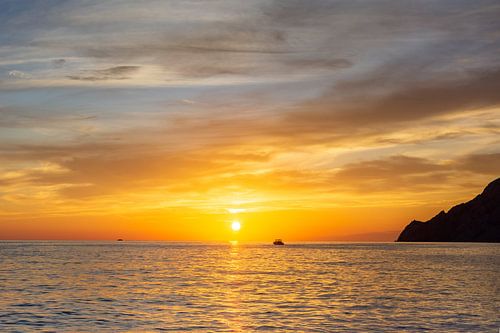 Fisherman heads home during sunset