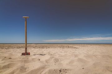 Shovel in sand by Michael Ruland