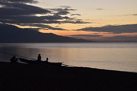 Maumere Bay at sunset by Erik Buitenhuis