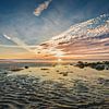 Noordzeestrand bij een zonsondergang in het najaar van eric van der eijk
