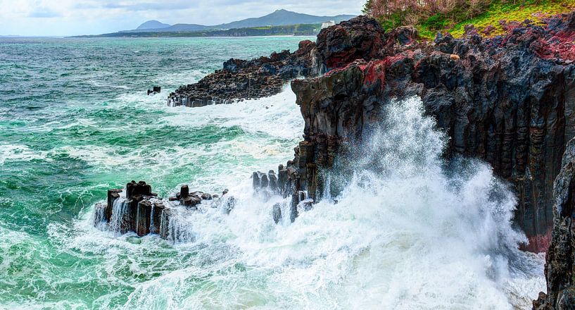 Volcanic rocky coast with storming sea by Yevgen Belich