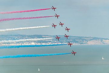 The Royal Air Force's Red Arrows in action during the 2014 Eastbourne International Airshow. by Jaap van den Berg