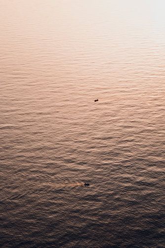 Bootjes tijdens zonsondergang