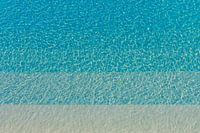 Different kinds of blue rippling water in a pool with sunshine