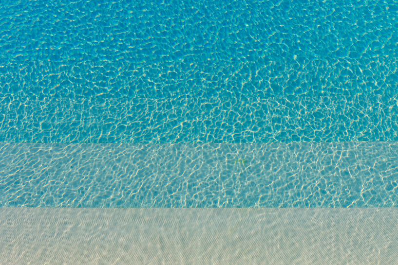 Different kinds of blue rippling water in a pool with sunshine by WorldWidePhotoWeb