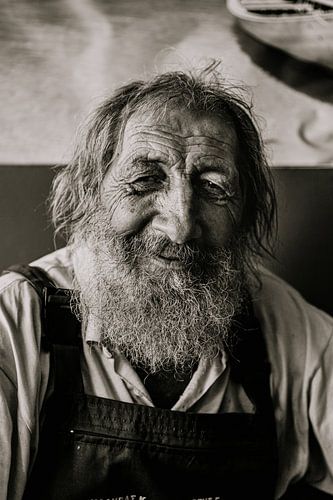 Greek fisherman in old cafe in Greece