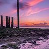 Sunset during low tide with beautiful colors by Rick van de Kraats