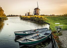 The mill of Leidschendam with a few boats in the foreground. by Claudio Duarte