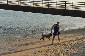 Man with sheepdog in Conil de la Frontera by Silva Wischeropp