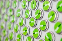 Apple green Fuze Tea caps on the wall