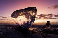 Sunrise through ice block 
