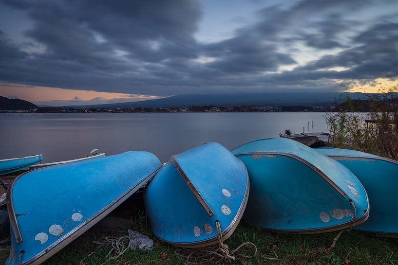 Lake Kawaguchi at sunset with the Fuji volcano shrouded in dark clouds by Anges van der Logt