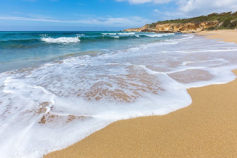 Sandy beach sea waves and mountain at coast by Ben Schonewille