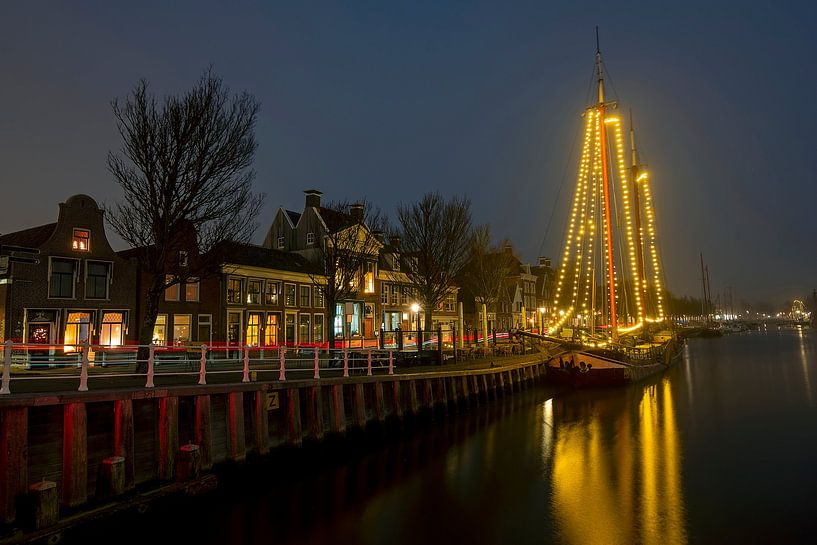 Decorated traditional sailing ship in Harlingen Friesland in the evening by Eye on You