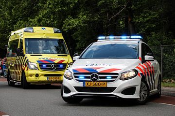 Mercedes B class police and ambulance with optical signals. by Mariska Bruin