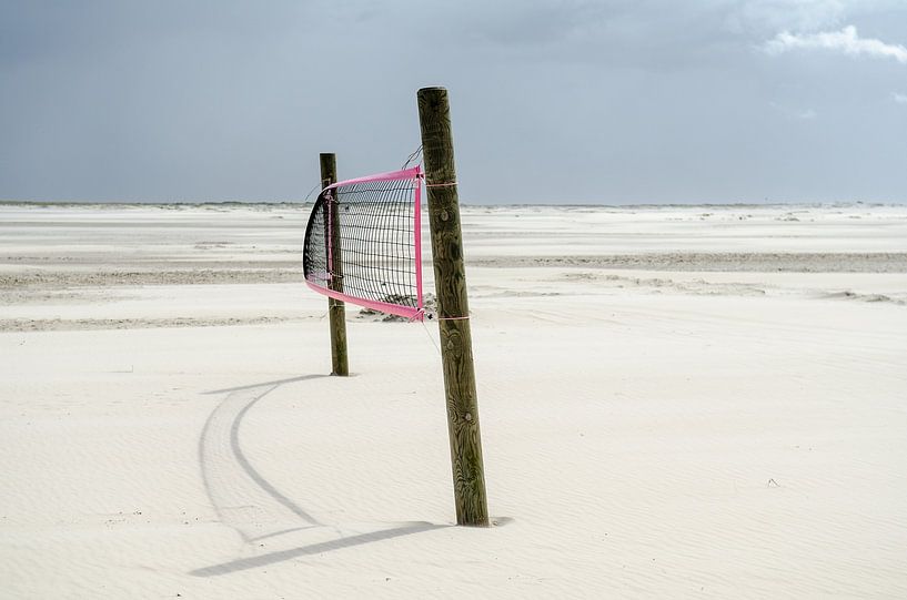 Volleyball net in the Wadden Sea of the North Sea by Alexander Baumann