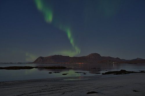Aurora Borealis with reflection on the Lofoten Islands