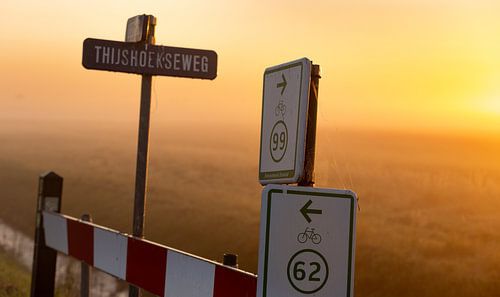 Cycling route with rising sun