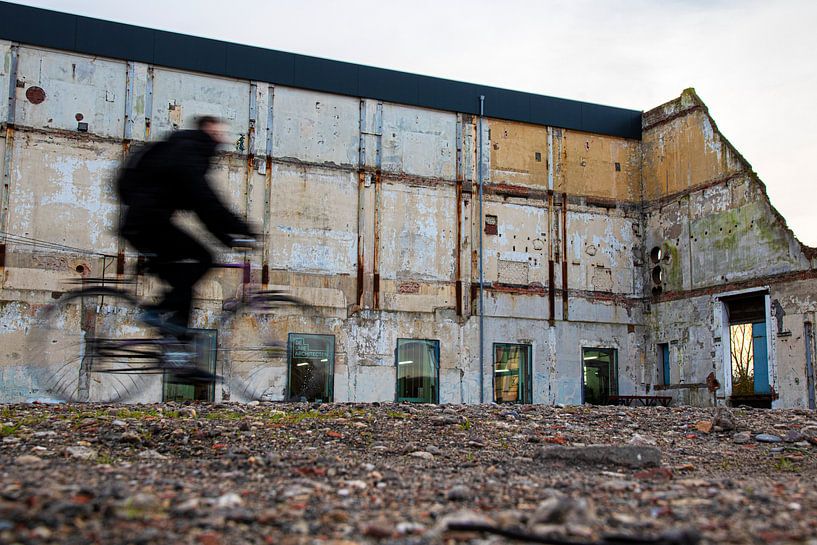 Cyclist at old sugar factory by Weg van het Noorden