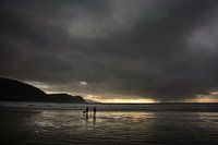 Walkers on the beach