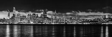 Panorama view of San Francisco skyline with reflection in bay at night in black and white in low key by Dieter Walther