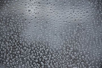Drops of water in a window by Claude Laprise