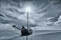 Black-and-white photo of a dry-fall sailing ship on a sandbank in the Wadden Sea by Bas Meelker thumbnail