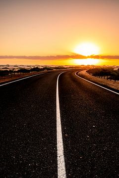 Beautiful morning on a road through the dunes. Sunrise over a road with clouds. Nationa by Fotos by Jan Wehnert