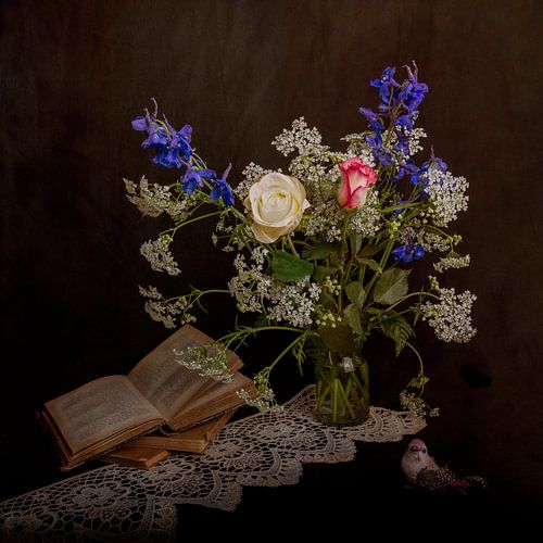 Still life with flowers and old books