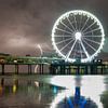 Thunderstorm behind the Ferris wheel on Scheveningen pier by Sjon de Mol