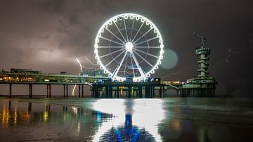 Thunderstorm behind the Ferris wheel on Scheveningen pier